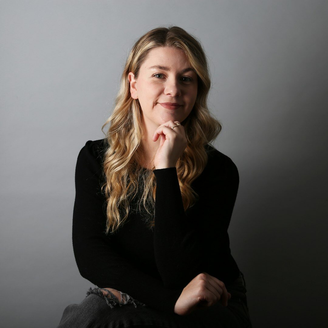 Professional woman expert coordinator smiling in business attire