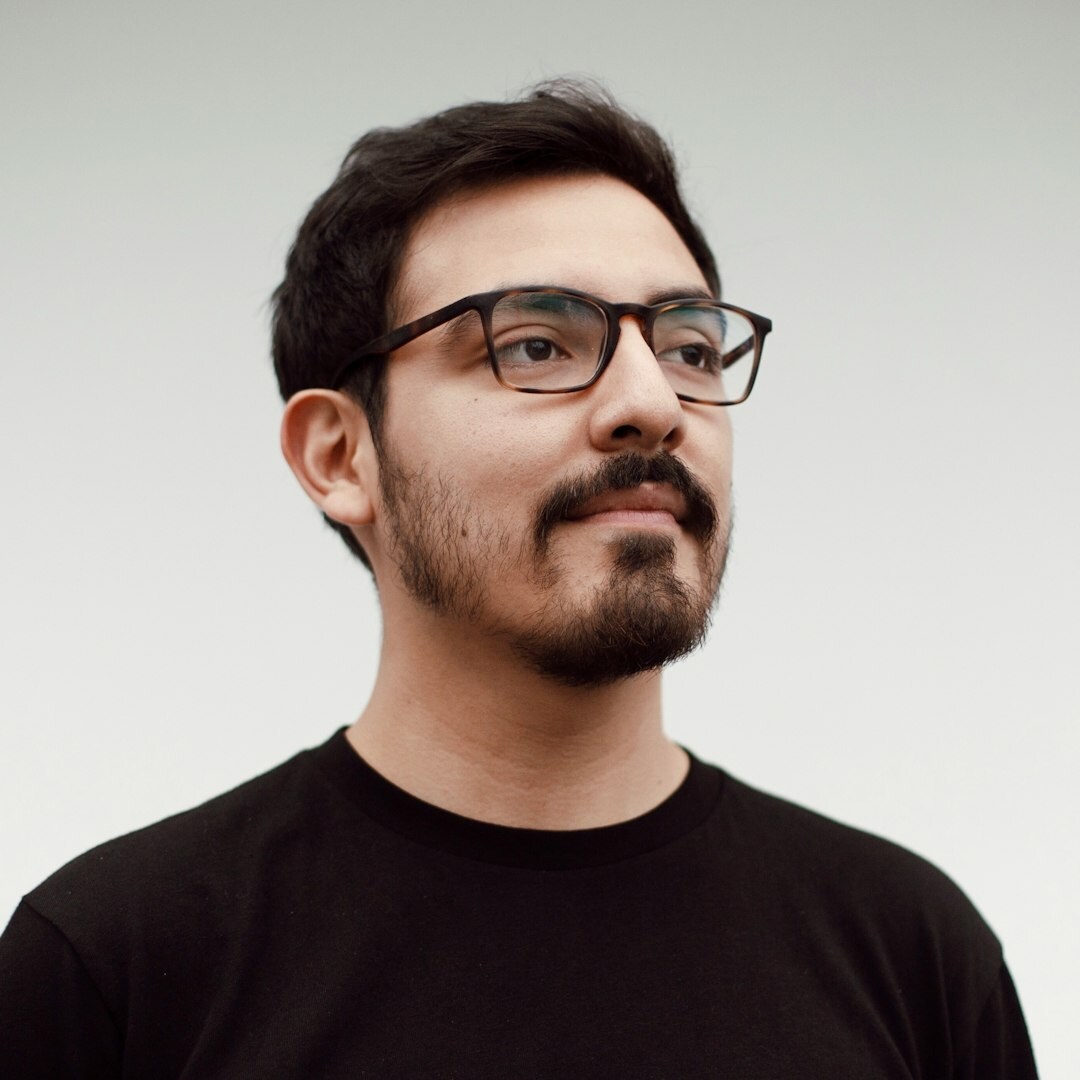 Professional man moderator portrait in business suit with glasses